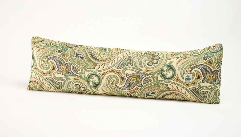 A heavy fabric draught excluder against the bottom of a door